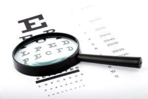 Eye Exam with a magnifying glass
