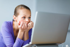 Woman reading off a computer
