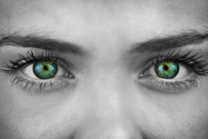 Woman looking with green eyes
