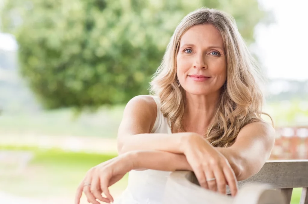 gorgeous 50 year old woman smiling outside